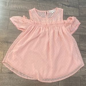 Girls blouse with off shoulder sleeves.
